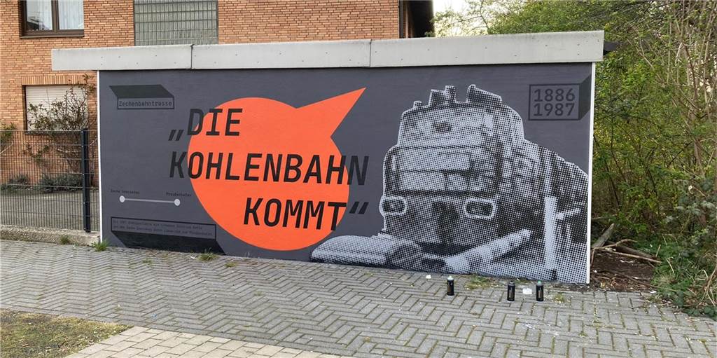 Schüler-Graffiti erinnern an Bergbau-Vergangenheit in Lünen-Süd Das Kunstwerk an der Garagenwand erinnert an die Zechenbahn, die bis 1987 durch den Stadtteil führte.