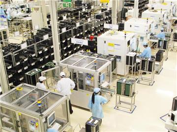Chinesische Arbeiter in einem Werk des deutschen Technologieunternehmens Bosch. Foto: Bosch/Archziv