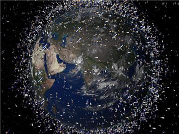 Das computergenerierte Bild der European Space Agency (ESA) zeigt Weltraummüll früherer Weltraummissionen, der neben intakten Satelliten um die Erde kreist. Foto: ESA/dpa