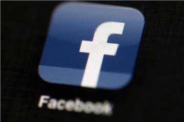 Das Facebook-Logo auf einem iPad. Foto: Matt Rourke/AP/Illustration