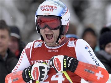 Der Schweizer Didier Defago jubelt über seinen Sieg beim Super-G in Kitzbühel. Foto: Herbert Neubauer