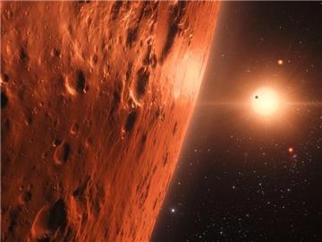 Die künstlerische Darstellung zeigt den Blick von der Oberfläche eines Planeten im Trappist-1-System. Foto: ESA/Hubble