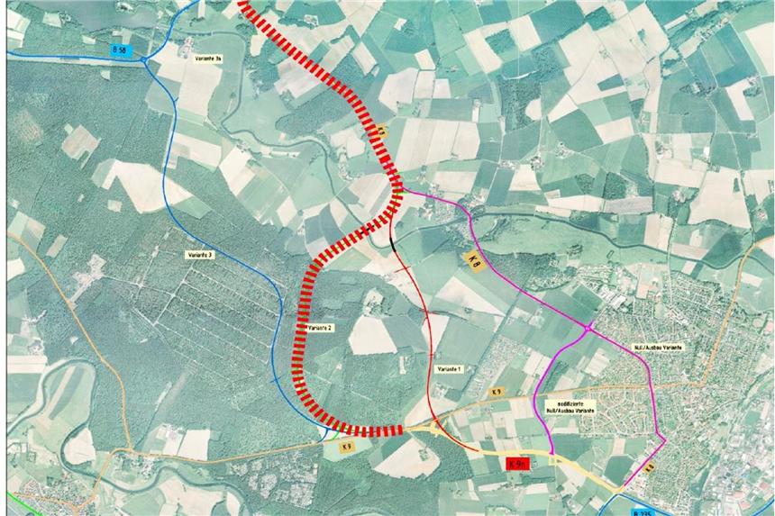Die zweite Variante der westlichen Umgehungsstraße für Olfen geht von der Eversumer Straße (K9) ab. Auch in diesem Fall dient die K9 AN5.1 als Zubringer, allerdings liegen zwischen dem Knotenpunkt der K9 AN5.1 / Eversumer Straße und dem Knotenpunkt K8n / Eversumer Straße ca. 250 m. In diesem Bereich wird die Eversumer Straße als Verbindung der beiden Olfener Umgehungsstraßen genutzt. Die Trasse der Variante 2 erfordert eine Querung der Stever. Rund 1.000 m flussaufwärts der Stever muss eine ca. 110 m lange Brücke errichtet werden. Ein fahrbahnbegleitender Radweg ist auf ganzer Länge vorgesehen. Die Gesamtlänge der Trasse beträgt 5.100 m (ohne Anschlüsse). Zum nördlichen Anschluss wurde bei dieser Variante der gleiche Punkt der Eversumer Straße (K8), wie bei der Variante 1 gewählt. Quelle: Kreis Coesfeld