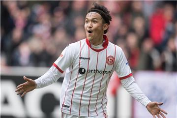 Düsseldorfs Takashi Usami jubelt über seinen Treffer zum 2:0. Foto: Bernd Thissen