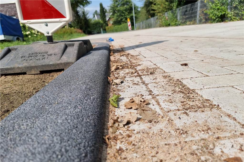 Endausbau „An der Windmühle“: Wichtige Frist für Anlieger läuft ab Eine gepflasterte Straße in Heek