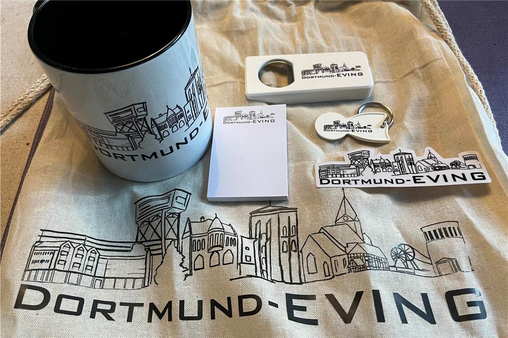 Neues Logo für den Stadtbezirk Eving zeigt wichtige Landmarken Es gibt kleine Give-Aways wie Tassen und Tragetaschen, die mit dem neuen Eving-logo bedruckt sind