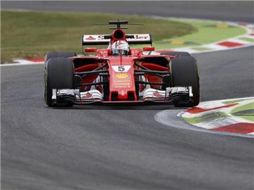 Ferrari-Fahrer Sebastian Vettel freut sich auf den Grand Prix in Singapur. Foto: Antonio Calanni