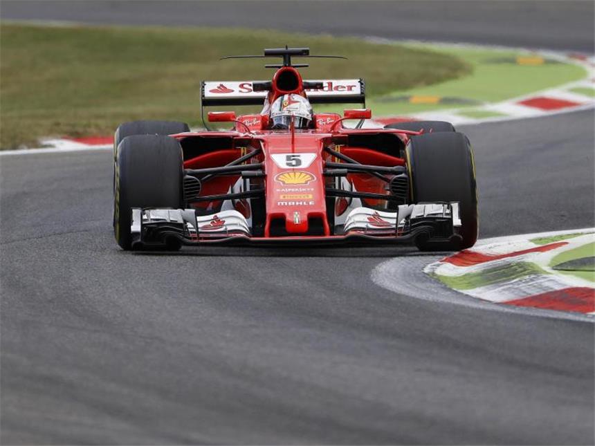 PS-Hatz durch Grünanlage: Vettel hofft auf Pole in Monza Ferrari-Fahrer Sebastian Vettel hofft auf die Pole Position beim Heimrennen in Monza. Foto: Antonio Calanni