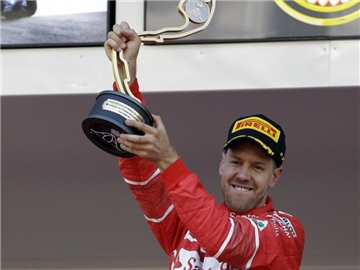 Ferrari-Fahrer Sebastian Vettel wurde nach seinem Sieg vor allem von der italienischen Presse gefeiert. Foto: Claude Paris