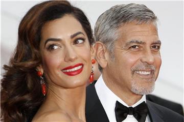 George und Amal Clooney 2016 in Cannes. Foto: Guillaume Horcajuelo