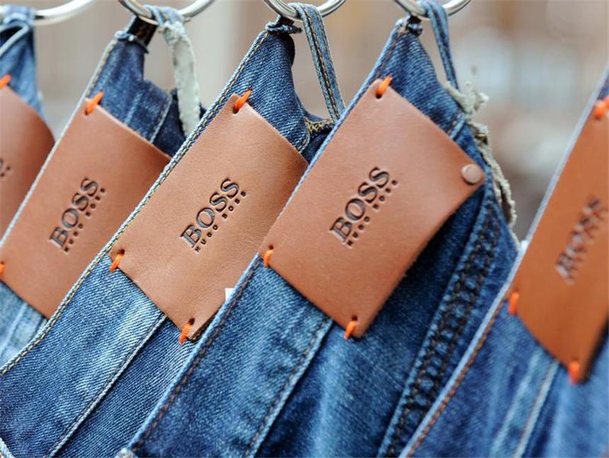Hugo Boss macht in eigenen Läden gute Geschäfte Gut abgeschnitten. Der Modekonzern Hugo Boss übertraf die Erwartungen der Analysten. Foto: Bernd Weißbrod dpa