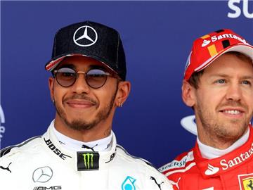 Haben beide den WM-Titel im Visier: Lewis Hamilton (l) und Sebastian Vettel. Foto: Tim Goode