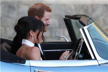 Harry und Meghan auf dem Weg zur Party. Foto: Steve Parsons/PA Wire