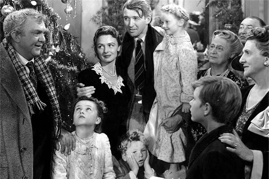 Schauspieler James Stewart, umringt von seiner Film-Familie.