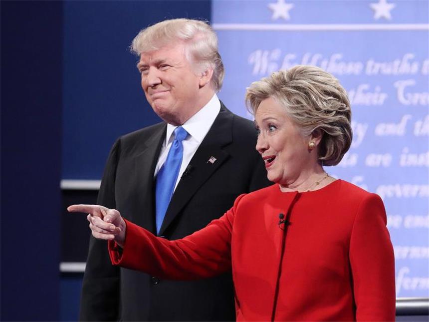 USA bezichtigen Russland wegen Hackerangriffen Kandidaten Trump und Clinton - die US-Regierung wirft Moskau vor, durch das Eindringen in Computersysteme die Präsidentschaftswahl beeinflussen zu wollen. Foto: Andrew Gombert