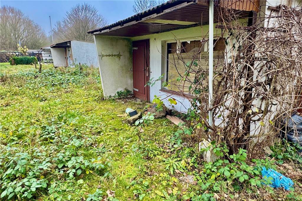 Kleingartenanlage „Am Massbruch“: Vandalismus und teurer Bach-Umbau Alte Gartenlauben