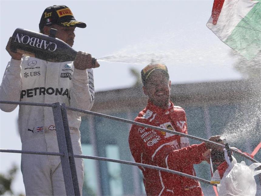 Die Lehren aus dem Großen Preis von Italien Lewis Hamilton (l) gewann den Großen Preis von Italien, Sebastian Vettel wurde Dritter. Foto: Luca Bruno