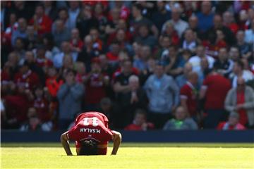 Liverpools Mohamed Salah kniet auf dem Boden nach seinem Tor. Foto: Dave Thompson/PA Wire