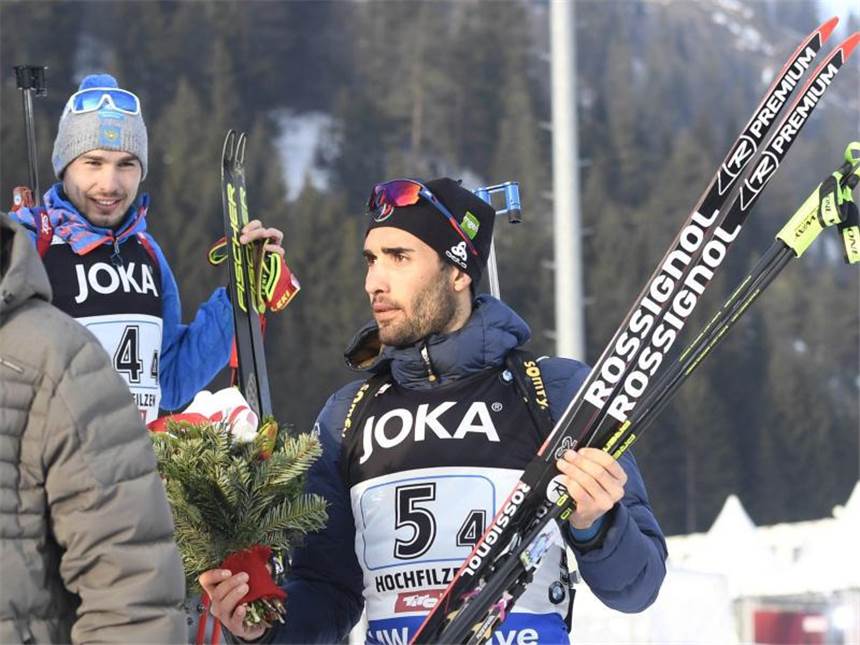 Deutsche Mixed-Staffel gewinnt Gold bei Biathlon-WM Martin Fourcade und Anton Schipulin (l) bei der Flower Ceremony des Mixed-Staffel-Wettbewerbs. Foto: Heikki Saukkomaa