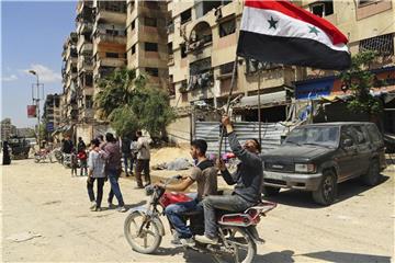 Nach wochenlangen Kämpfen hat die syrische Regierung die volle Kontrolle über die einstige Rebellenhochburg Duma im Gebiet Ost-Ghuta übernommen. Foto: SANA/AP