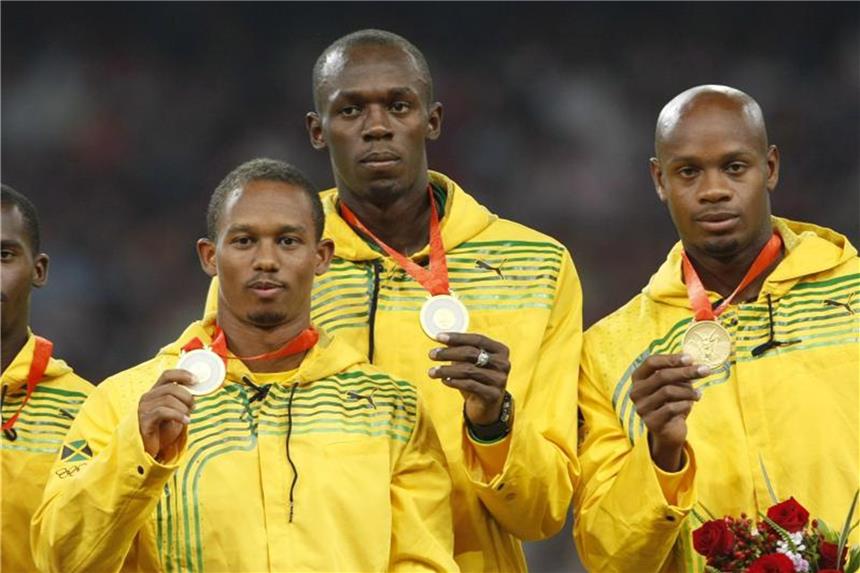 Nesta Carter, Michael Frater, Usain Bolt und Asafa Powell (l-r) mussten ihr Staffel-Gold von 2008 zurückgeben. Foto: Rungroj Yongrit/epa