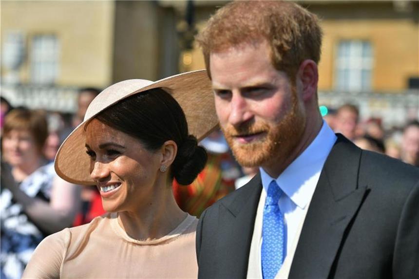 Harry und Meghan bei erstem offiziellen Termin Prinz Harry und Herzogin Meghan beim Gartenfest im Buckingham Palace. Foto: Dominic Lipinski