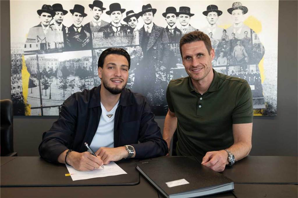 Bensebaini-Wechsel zum BVB perfekt – Linksverteidiger folgt auf Guerreiro: Das sind die Details Ramy Bensebaini unterschreibt seinen Vertrag.