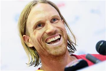 Spieler Michael Lang lacht. Foto: Laurent Gillieron/KEYSTONE