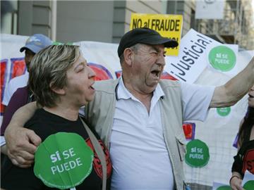Wut in Spanien. Betroffene der Immobilienkrise protestieren in MKadrid. Foto: Juan Carlos Hidalgo