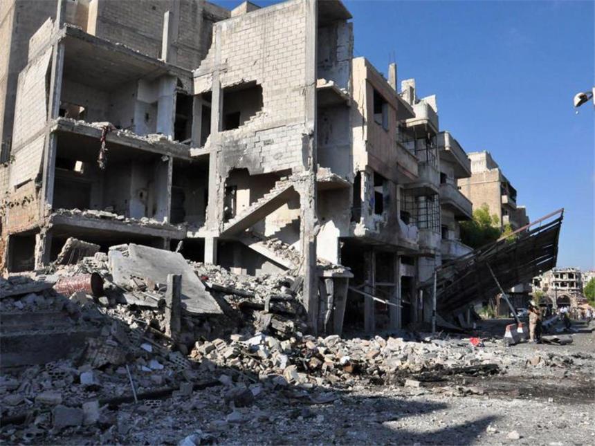 Russland verteidigt Luftangriffe auf Aleppo Zerstörte Gebäude in Bab Tadmour, einem Stadtteil von Homs. Foto: Sana